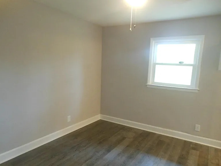 Single bedroom units with ceiling fans, bathrooms, & walk in closets. Windows face large natural area.
