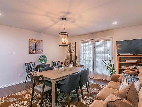 View of front dining or living space with ceramic tile, French doors open to front covered patio to enjoy fresh air