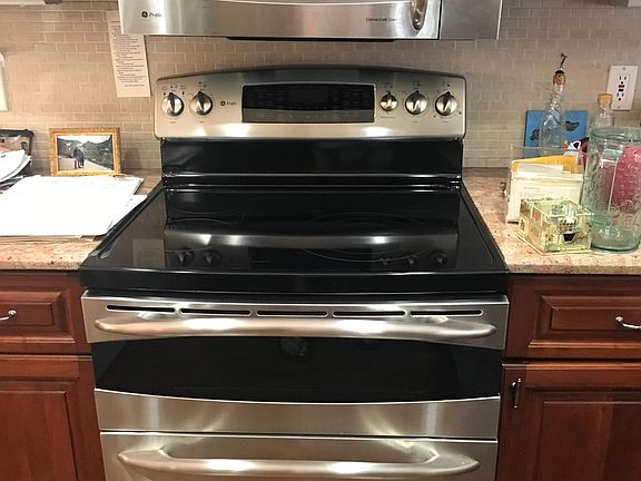 Stainless appliances and custom cabinets