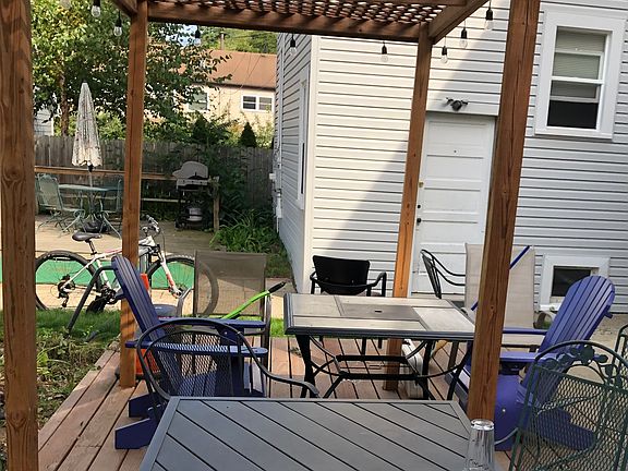 Covered patio with lights and furniture