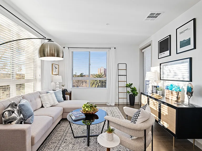 Soak up the sunshine in this beautifully styled living room_where comfort, natural light, and modern design come together effortlessly.
