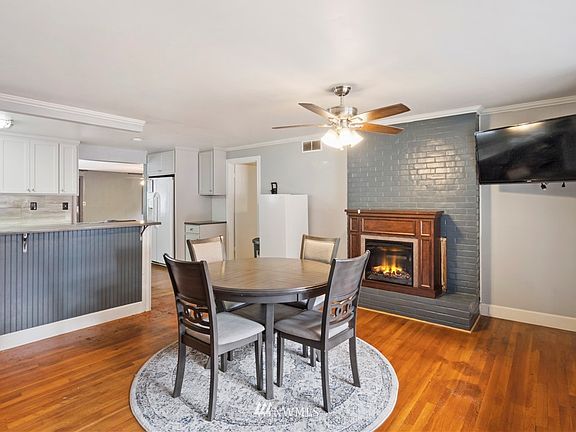 Entryway welcomes you with original hardwood flooring.