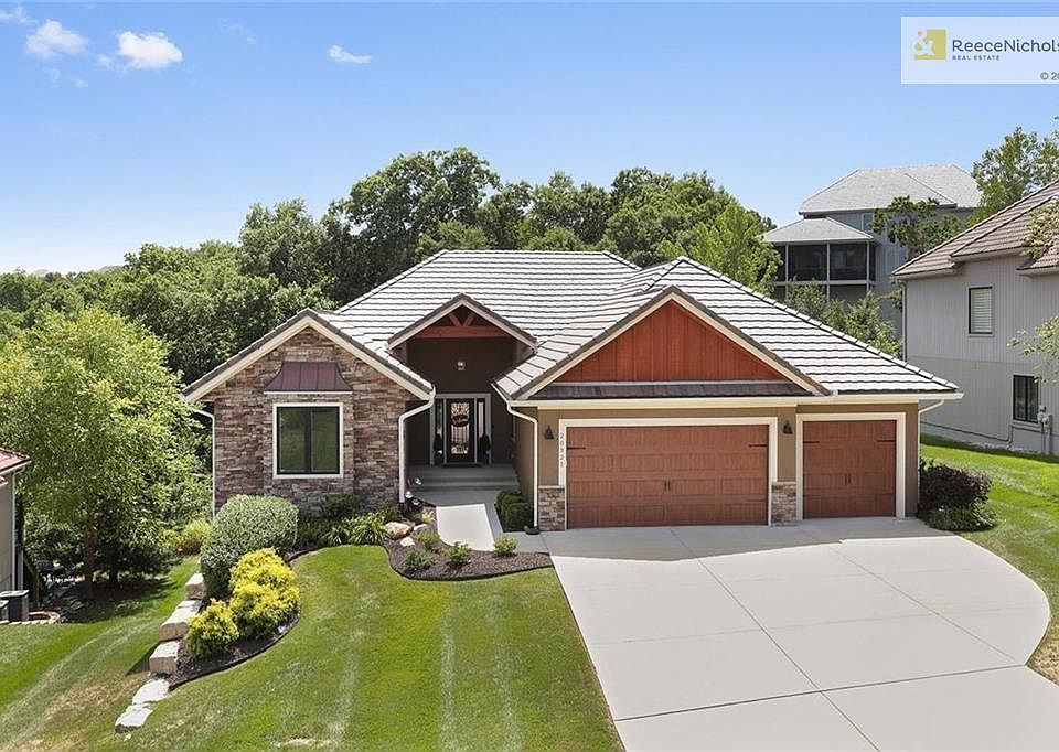 WELCOME HOME to this custom-built ranch/reverse, sitting on a gorgeous lot, backing to trees and with view of the nearby pond/fountain.  All-stucco exterior, Monet concrete tile roof.