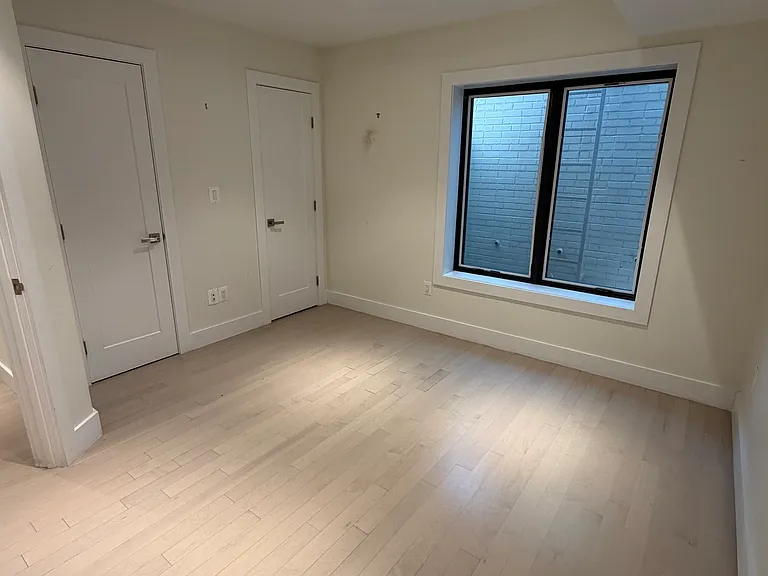 A well-sized second bedroom featuring an en-suite bath and generous closet space