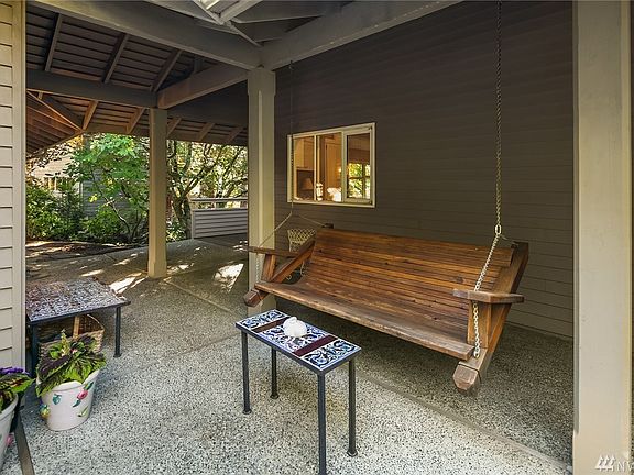 Breezeway and patio with custom built floating seat. Great for morning reflections. 