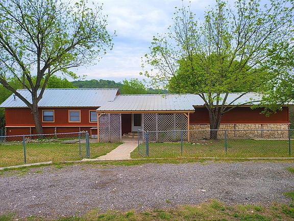 Front view. Metal fenced