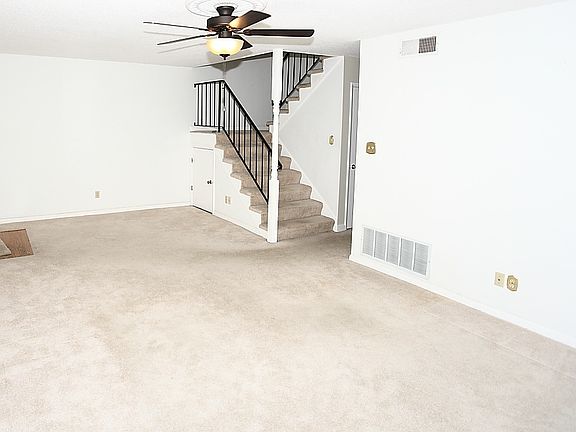 living room with stairs to bedrooms