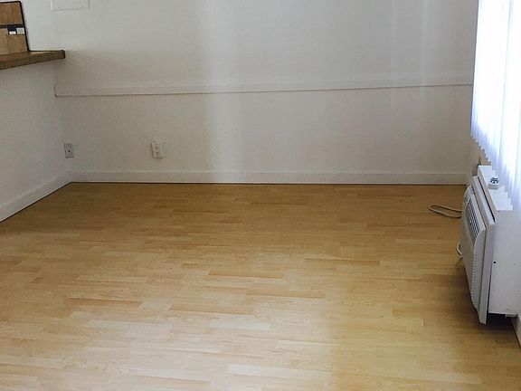 Good size living room with hardwood floors.