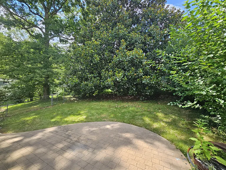 Fenced back yard with patio and privacy.