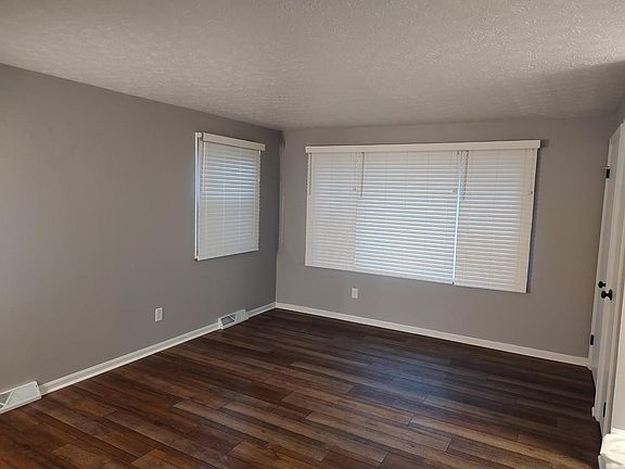 Livingroom with Bali wood vertical blinds thru-out the duplex