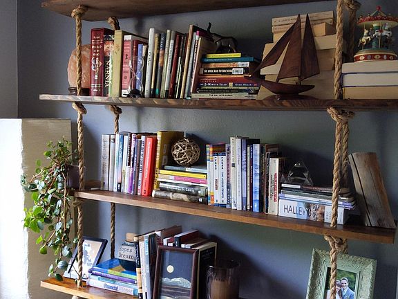Have you ever seen a hanging bookshelf? This can stay or be moved.