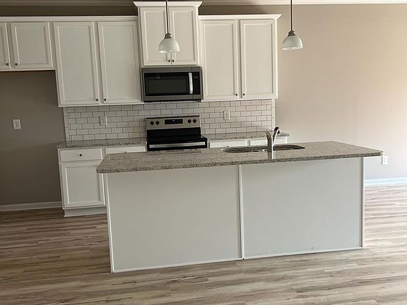Kitchen with Island and Granite Counters