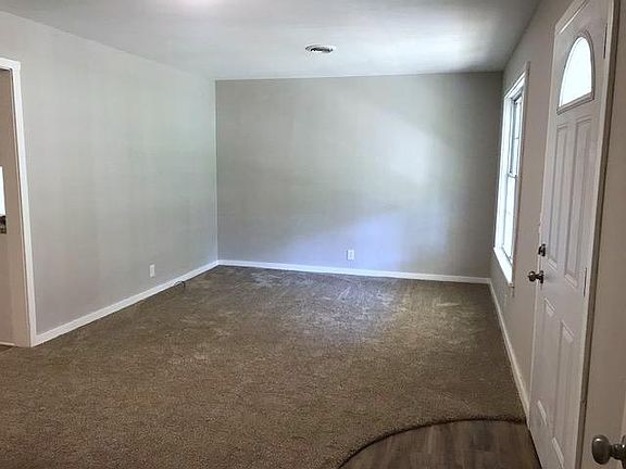 Neutral modern gray tones throughout the house, new carpet i