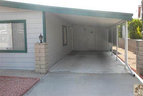 Carport with large shed