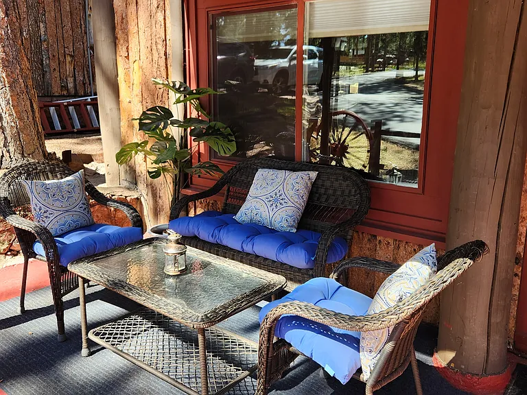 Come sit on the porch and enjoy the Summer with the Garden Furniture included. This is a great place to sit with a friend.
