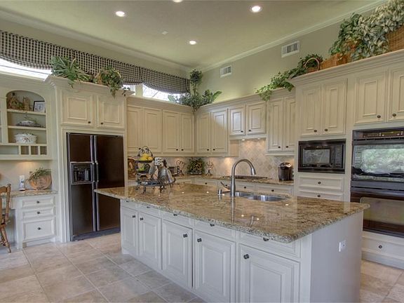 This beautiful kitchen has an extra large island and lots of cabinet space.