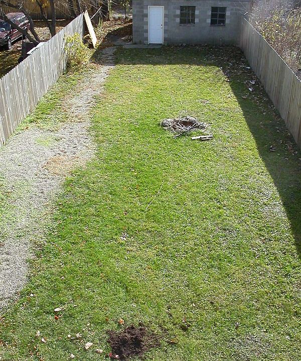 Fenced yard with garage & fire pit