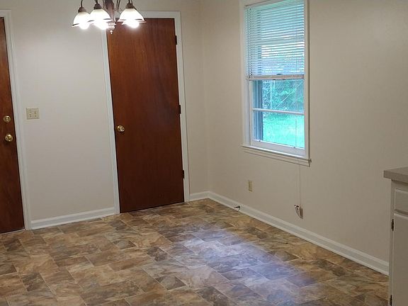 Dining area with pantry door & door to garage