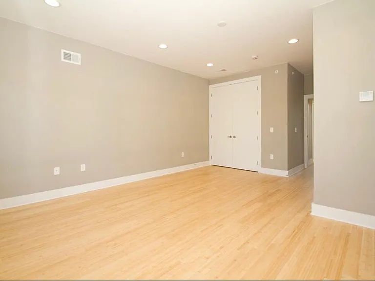 Main bedroom with ample natural light and walk-in closet