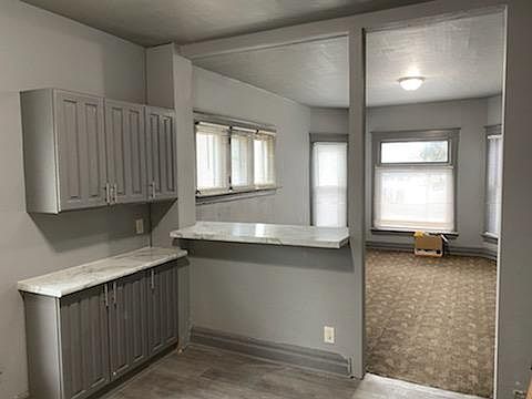 Kitchen overlooks living space.