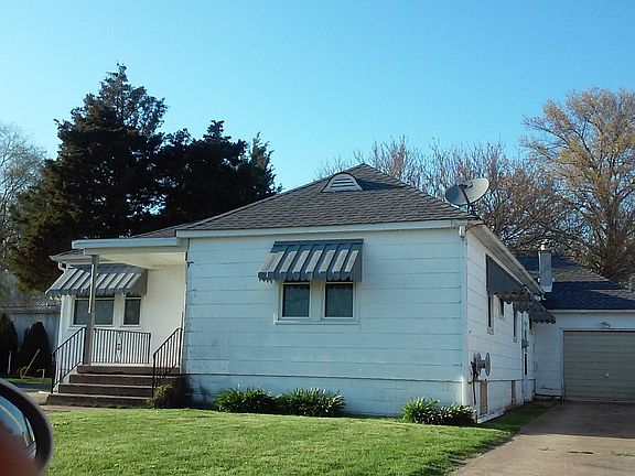 front view from side showing garage and drive way