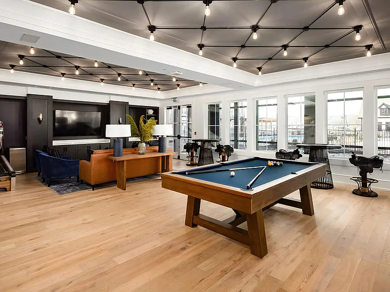 Recreation Area with Game Tables and Ample Natural Light