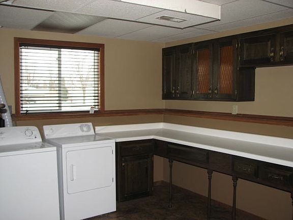 large lower level laundry with storage