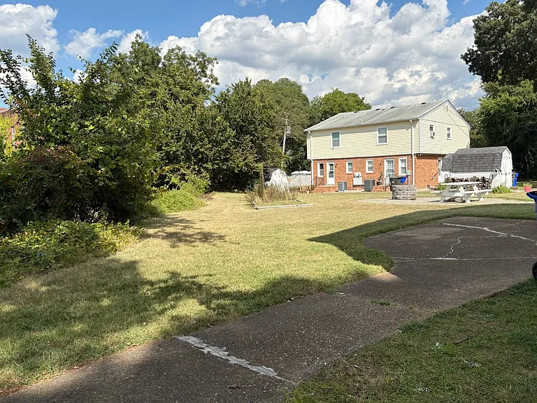 3 duplexes on property. Off-street parking, storage sheds, picnic tables for residents of duplexes.