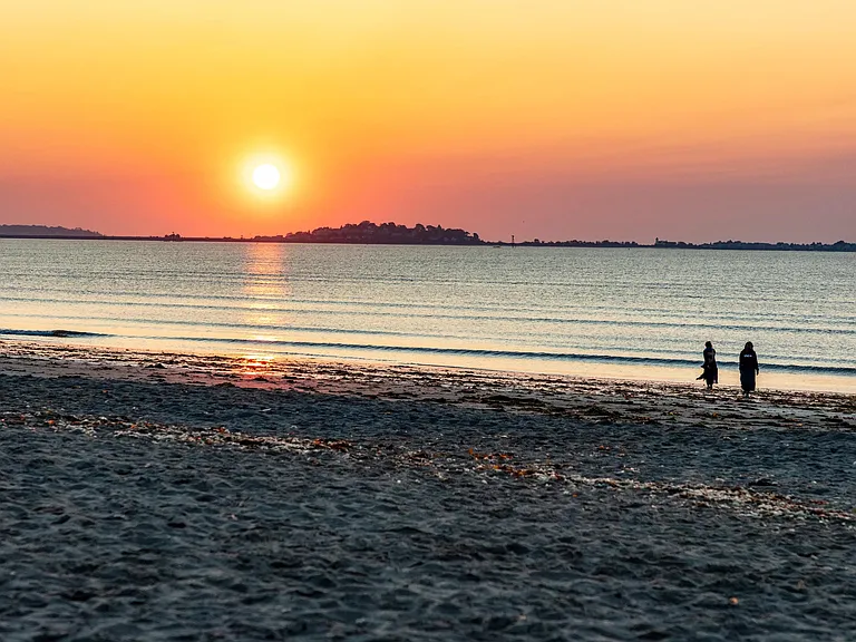 Revere Beach sunsets set the tone for tranquil evenings, with golden skies and gentle waves just steps from home.