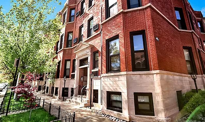 "Gaslight Village Condominiums" at the corner of George and Halsted