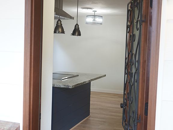 Entry to open concept living space with bedrooms in back of home