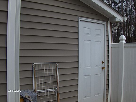 attached storage unit in enclosed patio