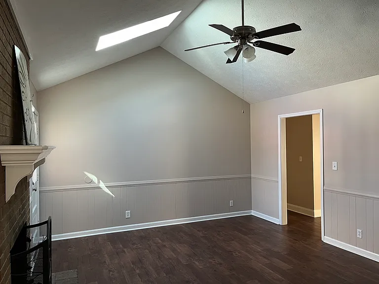 family room with skylight and ceiling fan