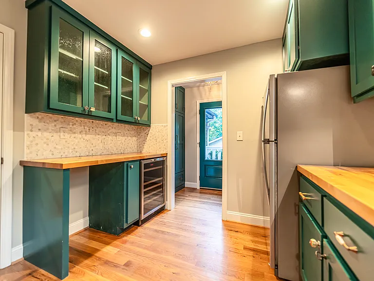 But wait, there's more! In addition to the custom kitchen, there is also a custom scullery! Including an extra refrigerator, extra sink, wine frig, and a space to add a kegerator.