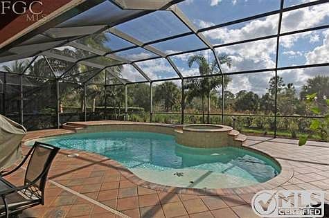 Look At This Amazing Lakeside Pool With An Elevated Spa, Paver Deck, And Southern Exposure!!