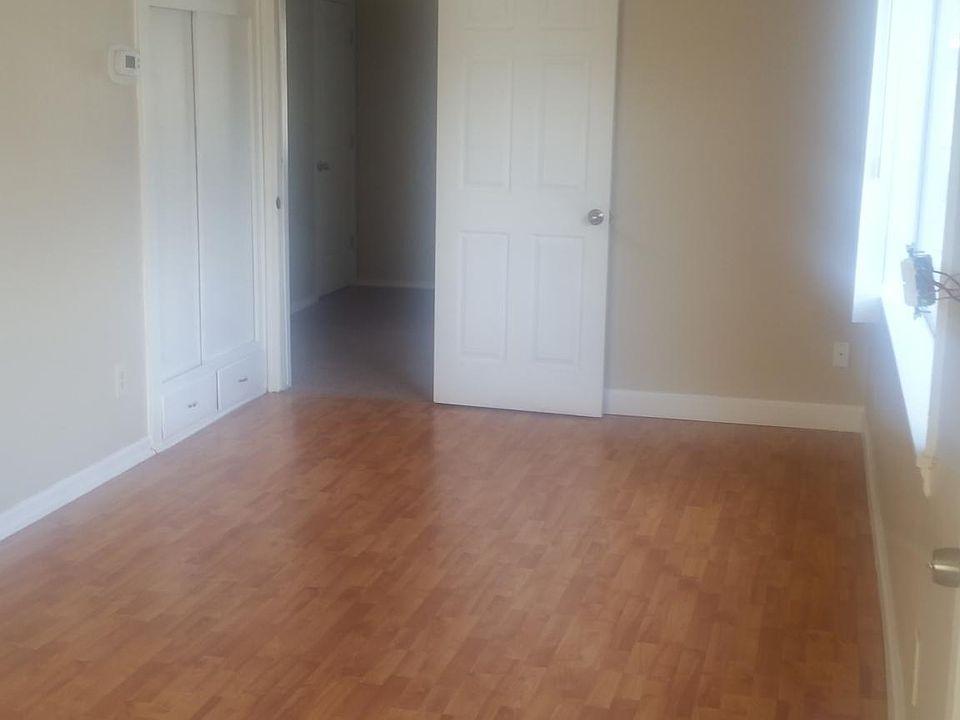 Living room area with door to bedroom