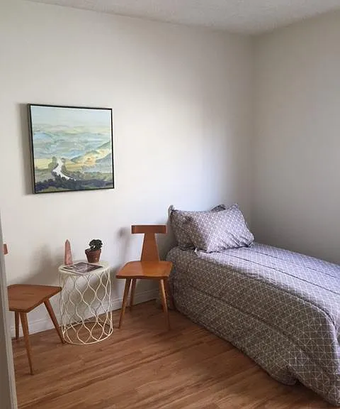 Plenty of room for a Queen, but this person chose to have a sitting area next to the bed.