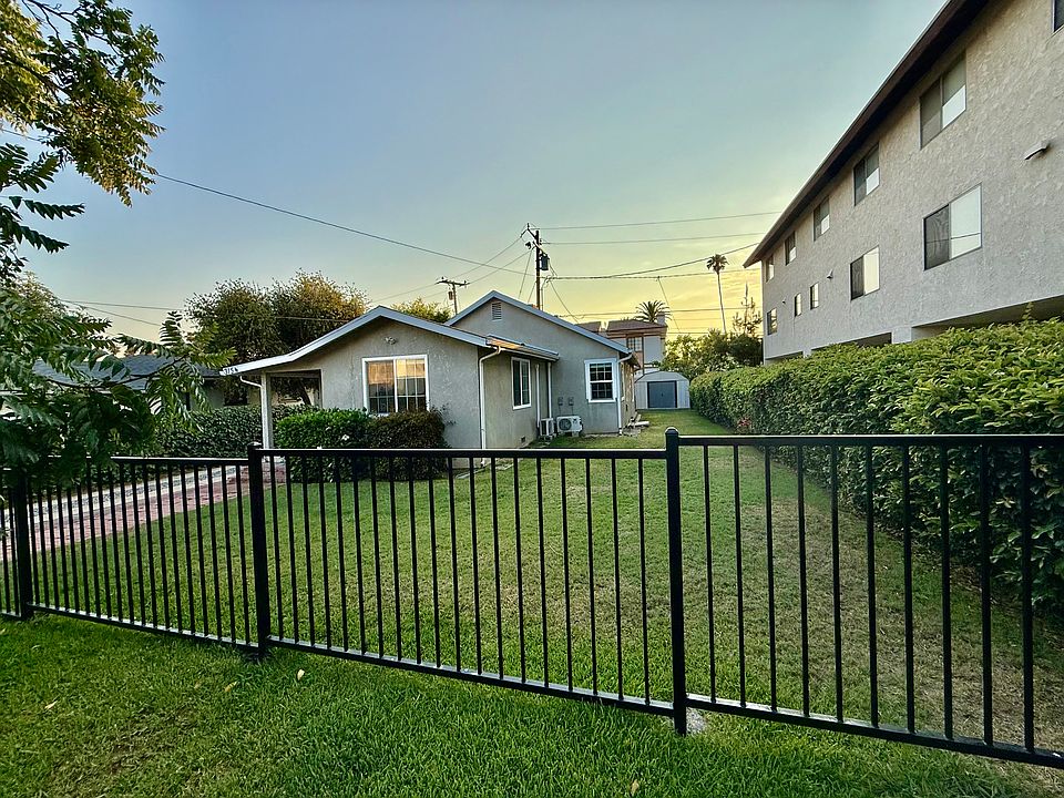 The Front of the house with front & side yard.
