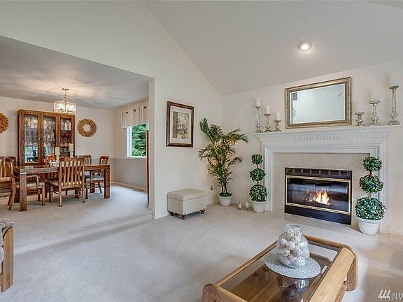 Stay connected with your guests in the formal dining room through the wide archway.