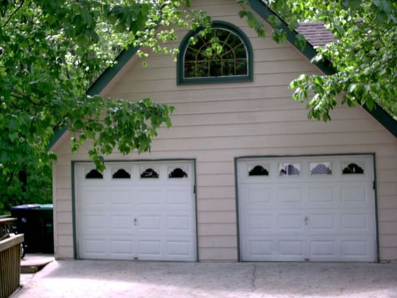Huge 2 car garage with boat door underneath and unfinished loft above!