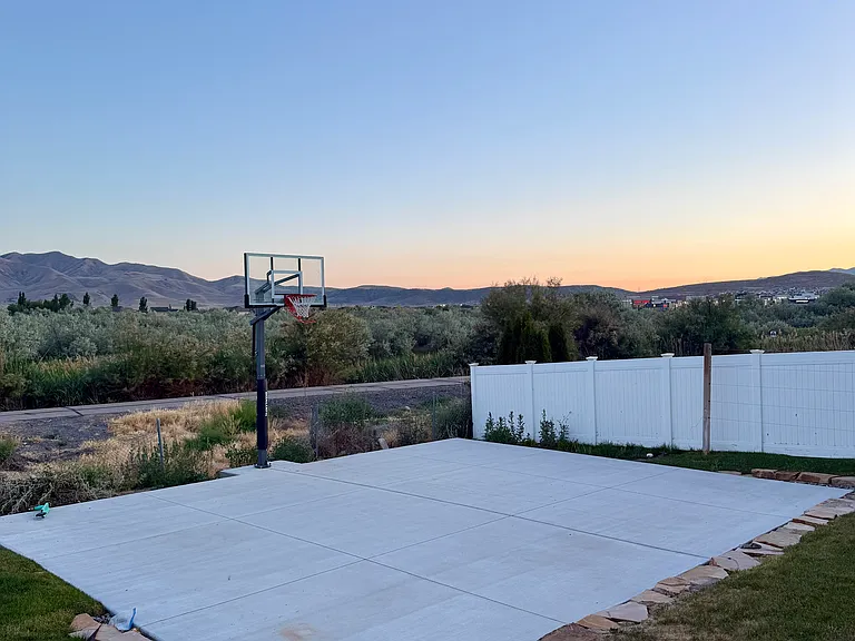 25X30 Ft basketball court with adjustable hoop.