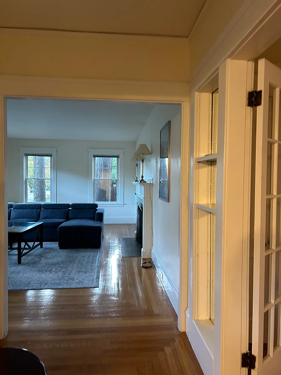 Front hallway from dining room to living room with French doors to inner hallway on the right. - 294 Butler Ave #1