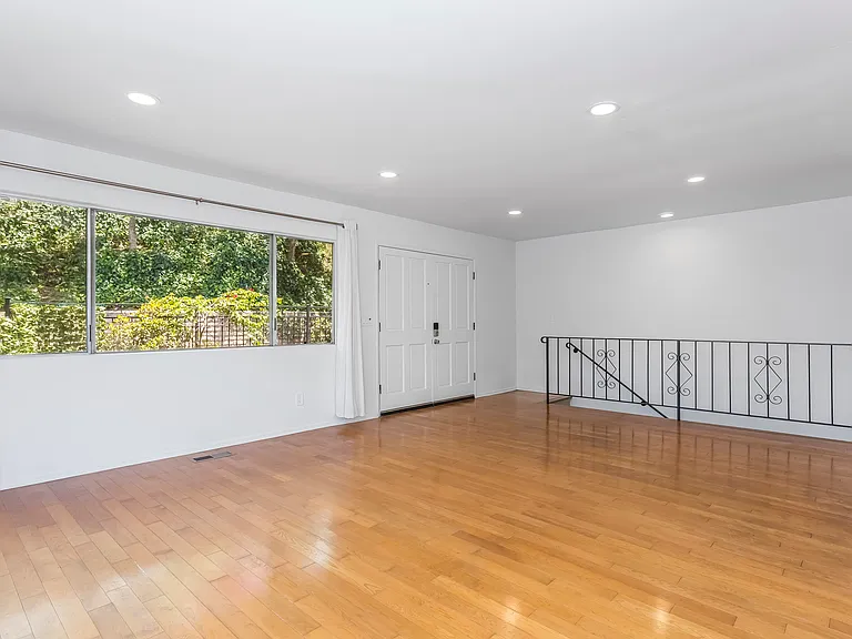 Open floorplan with recessed lights, gorgeous hardwood floors.