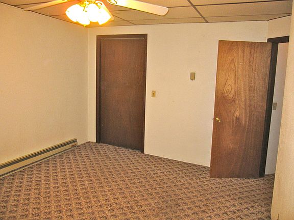 Inside bedroom. Left door is closet. Right door to bath.