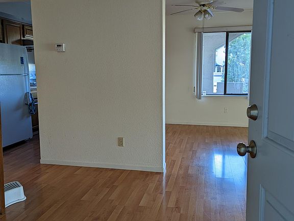 Front door opens to a small foyer, dining room straight ahead, kitchen to the left.