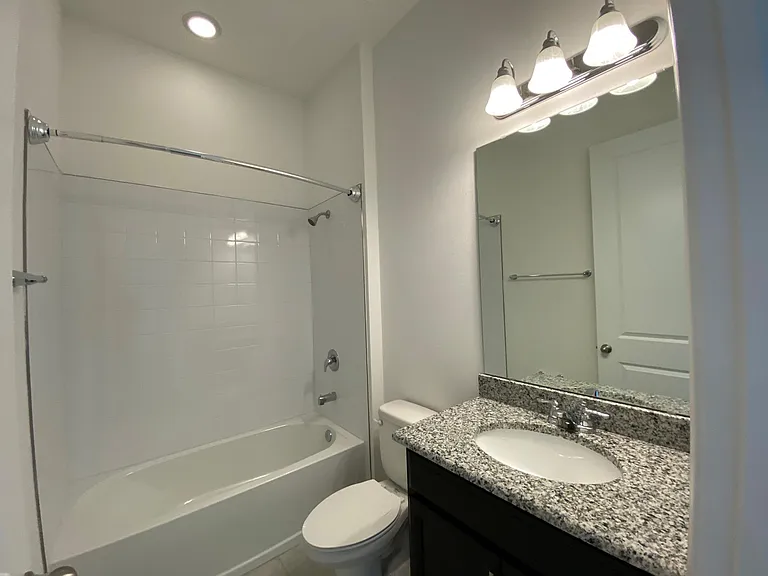 Inside the bathroom. The shower rod is curved for more elbow space while taking a shower.