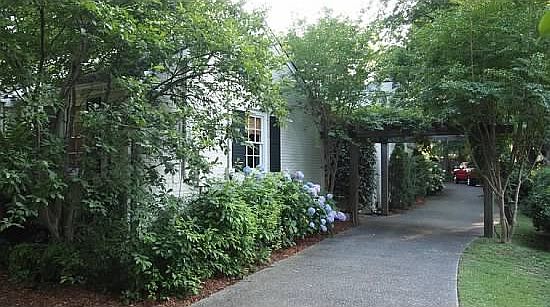 View of driveway & trellis adjacent to side entrance  