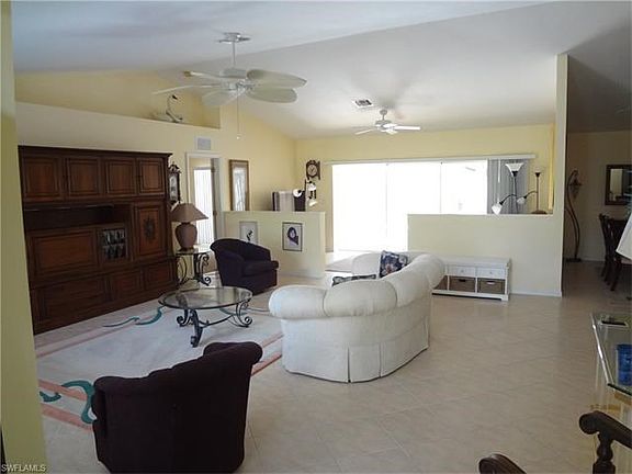 Living room looking toward pool deck sliders.