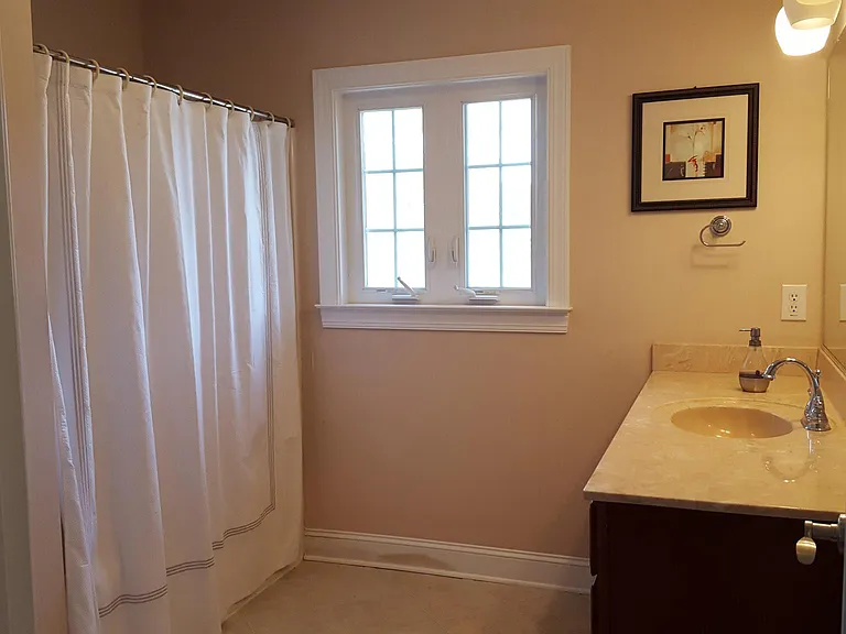 Upstair 3rd Full bathroom. Sink, toilet, tub shower combo with linen closet