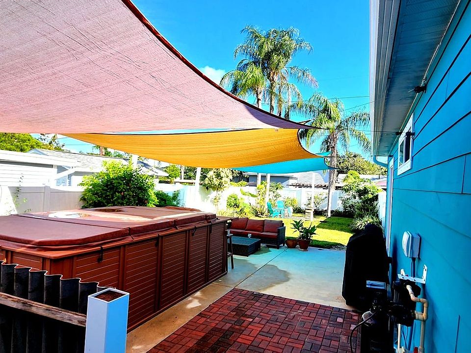 Spacious backyard with ample seating space and a large above ground spa for you, your guests and family enjoyment.